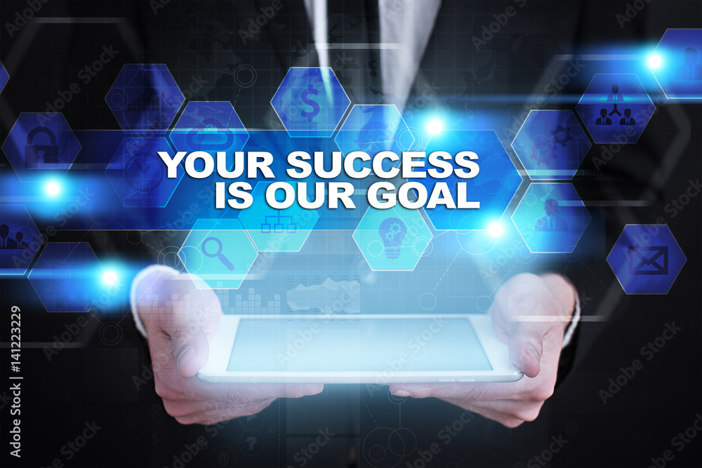Businessman holding tablet PC with your success is our goal concept. Businessman holding tablet PC with your success is our goal concept.
