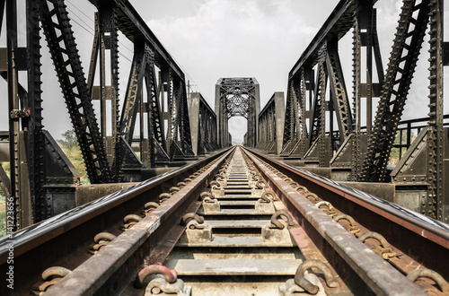 Steel structure of railway bridge, railway rail with vanishing point, amazing perspective