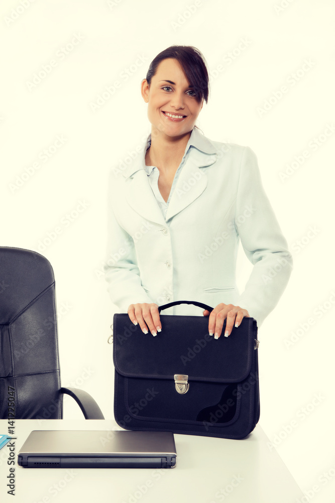 Young attractive business woman with briefcase at the office Young attractive business woman with briefcase at the office