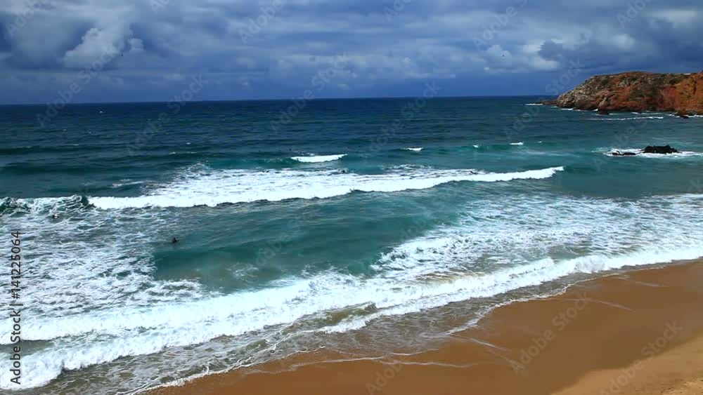 Beautiful ocean waves on a sandy beach Amado. Atlantic Ocean, Algarve, Portugal Beautiful ocean waves on a sandy beach Amado. Atlantic Ocean, Algarve, Portugal