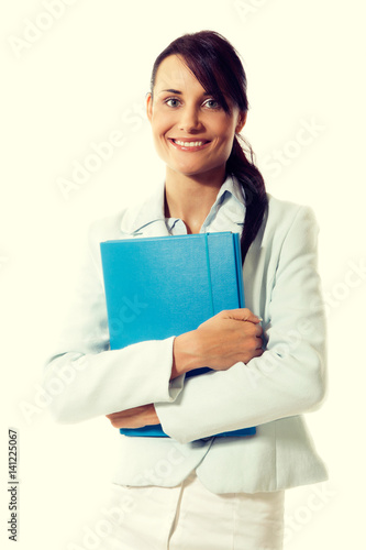 Young attractive business woman with briefcase at the office
