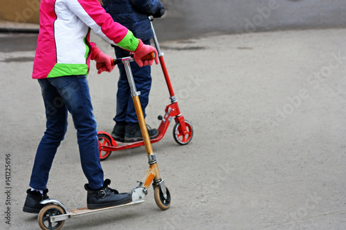 Riding a Kick scooter.