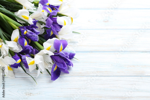 Fototapeta Naklejka Na Ścianę i Meble -  Bouquet of iris flowers on white wooden table