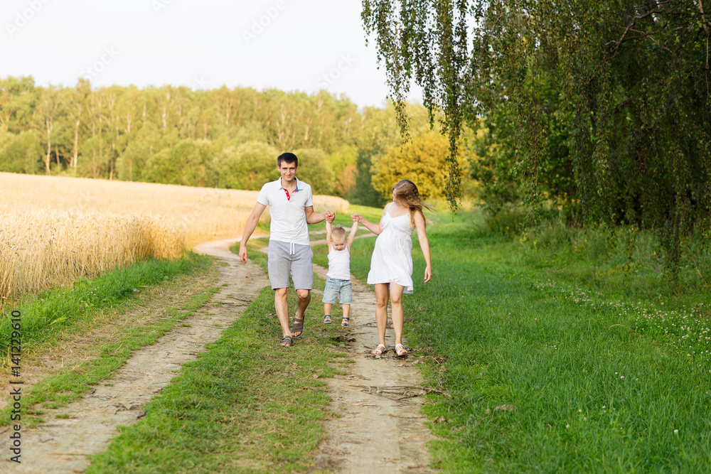 Fototapeta premium Portrait of beautiful young future parents outdoors