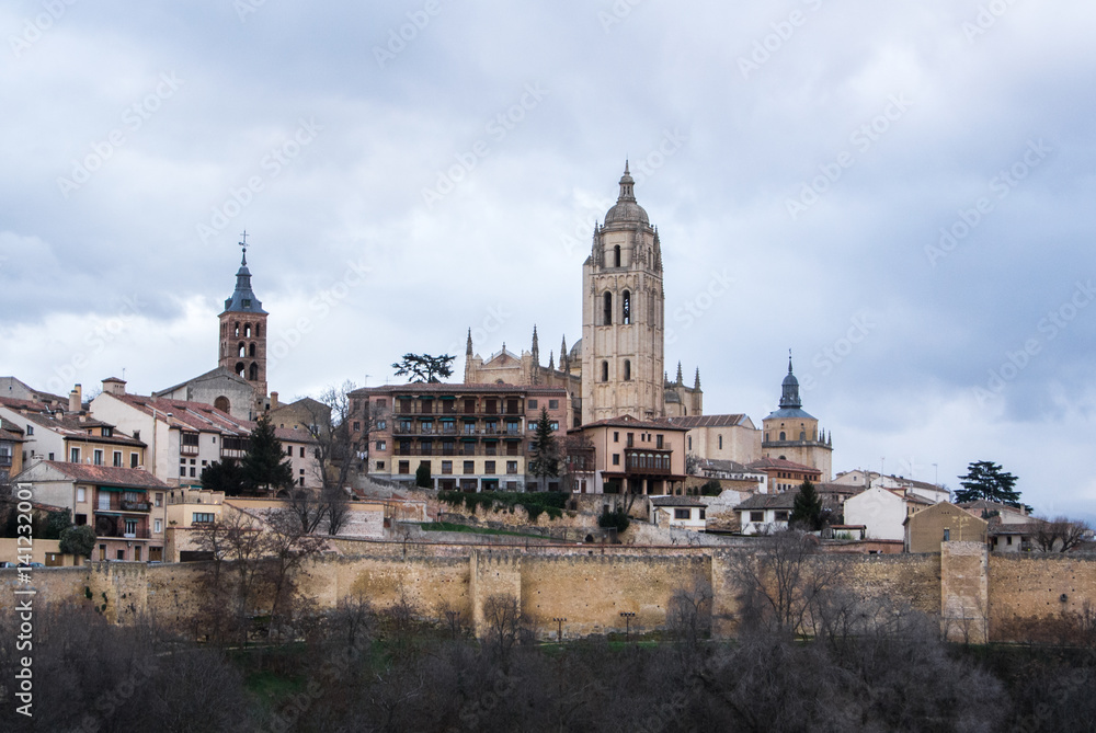 An iconic view to the center of Segovia, Cathedral and old medieval buildings over the hill, Segovia, Castille and Leon, Spain.