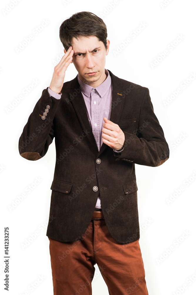 Terrible headache. young man touching his head with his hands, standing Terrible headache. young man touching his head with his hands, standing