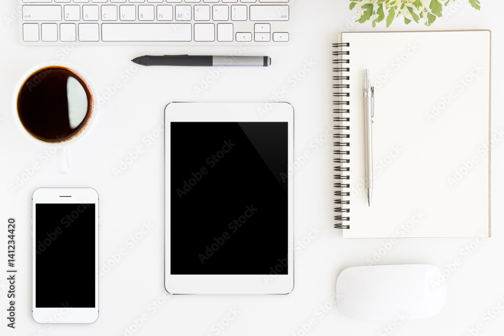tablet showing blank screen on white work desk top view tablet showing blank screen on white work desk top view