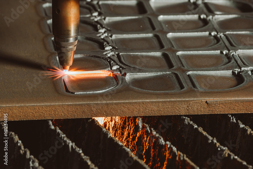 Steel cutting process with gas. Oxy-fuel cutting are processes that use fuel gases and oxygen to weld and cut metals photo