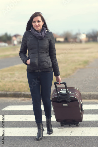 Full length portrait of a pretty traveler © SasaStock