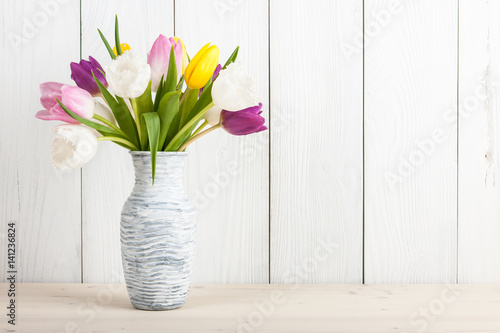Fresh colorful tulips bouquet in jug