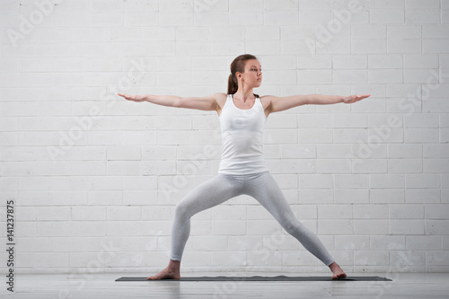 Portrait of young attractive woman practicing yoga