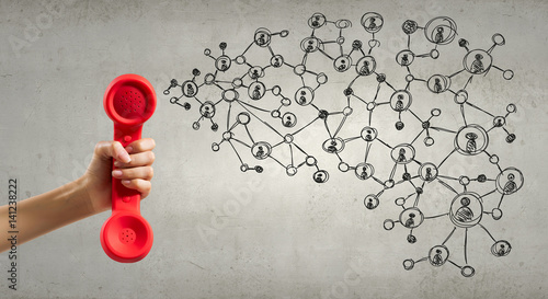 Retro red phone receiver . Mixed media