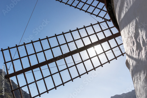 Closeup of a winmill wing with blue sky in background