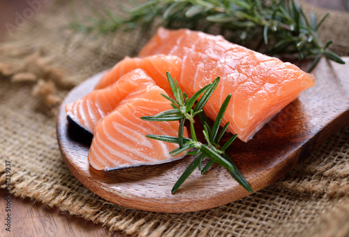 salmon with rosemary on the wood background