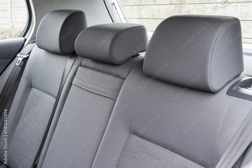 Modern car interior details of rear banch with headrest and belt. Modern car interior details of rear banch with headrest and belt.