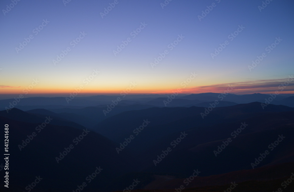 Mountains ridge, blue skyline with sunset. Color Gradient Mountains ridge, blue skyline with sunset. Color Gradient