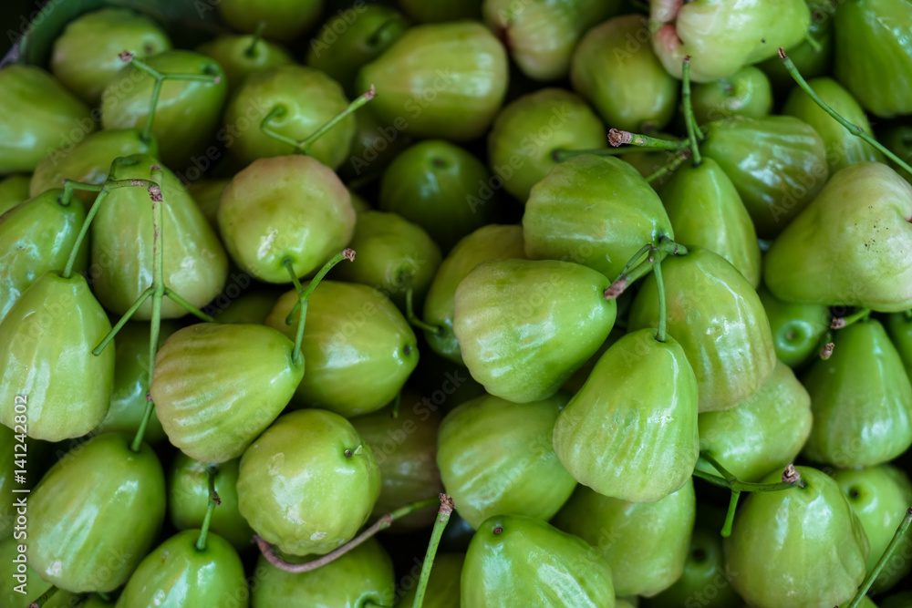 Fresh green rose apple fruit with sunlight reflection Fresh green rose apple fruit with sunlight reflection