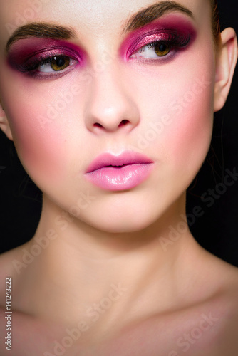 Beauty Fashion Model Girl with pink make-up  close-up studio shoot