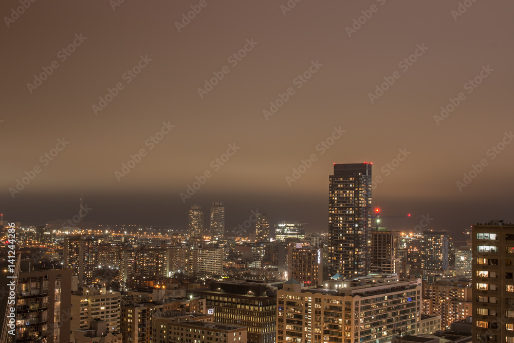 Nighttime City Scape with Low Clouds
