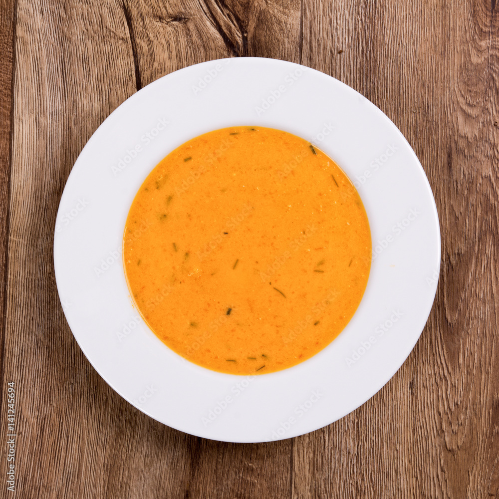 Vegetable soup on a wooden table Vegetable soup on a wooden table