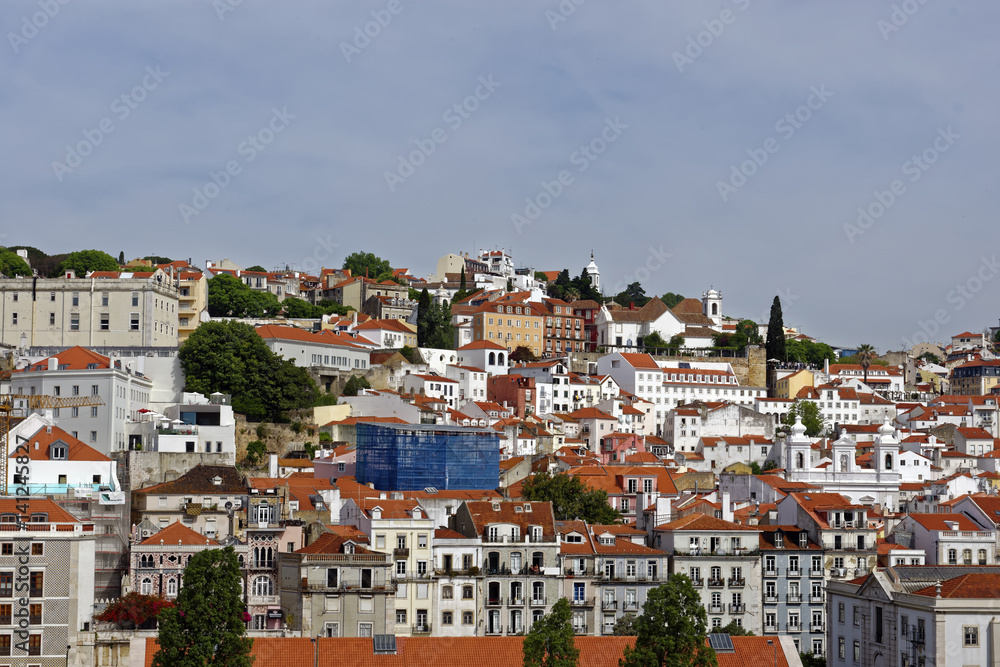 View from the River Tagus of the colorful hilly Lisbon, Portugal