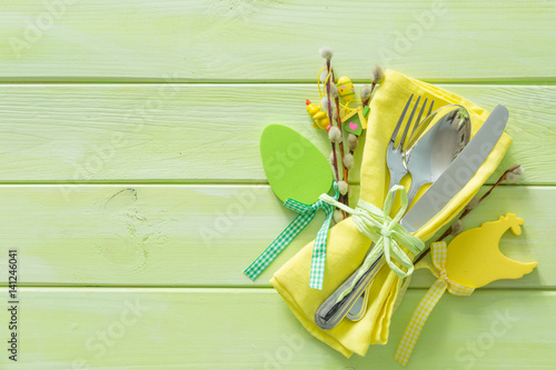 Easter table setting on wood background