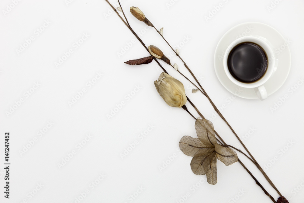 coffee cup with paper flower on white paper background. coffee cup with paper flower on white paper background.