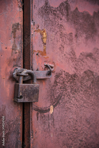 The old door locked with a padlock hanging brackets. Set of backgrounds