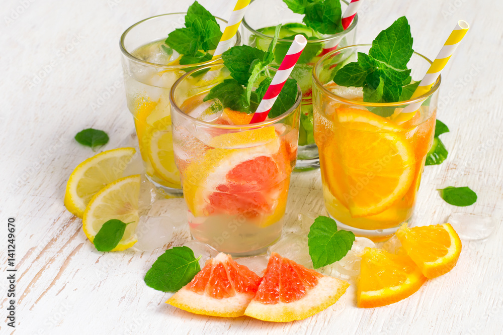 Set of Cucumber grapefruit lemon orange mint infused water for detox on a white background. Concept of summer drinks Set of Cucumber grapefruit lemon orange mint infused water for detox on a white background. Concept of summer drinks