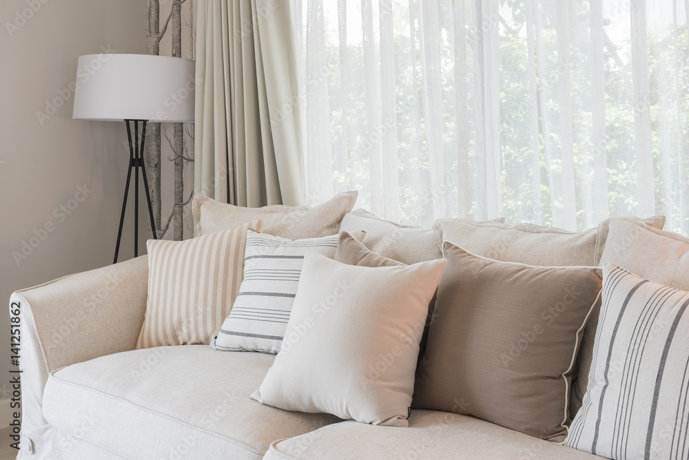 set of pillows on classic sofa in modern living room