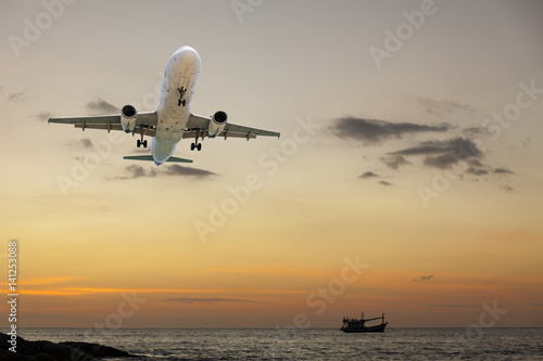 aircraft flying with scenic view of beautiful sunset and sea over the andaman.