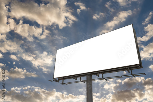 Blank billboard ready for new advertisement. Cloudy sunset blue sky.