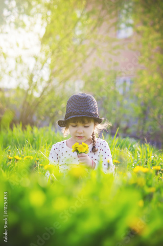 Girl with flowers in the spring outside. Selective focus.  