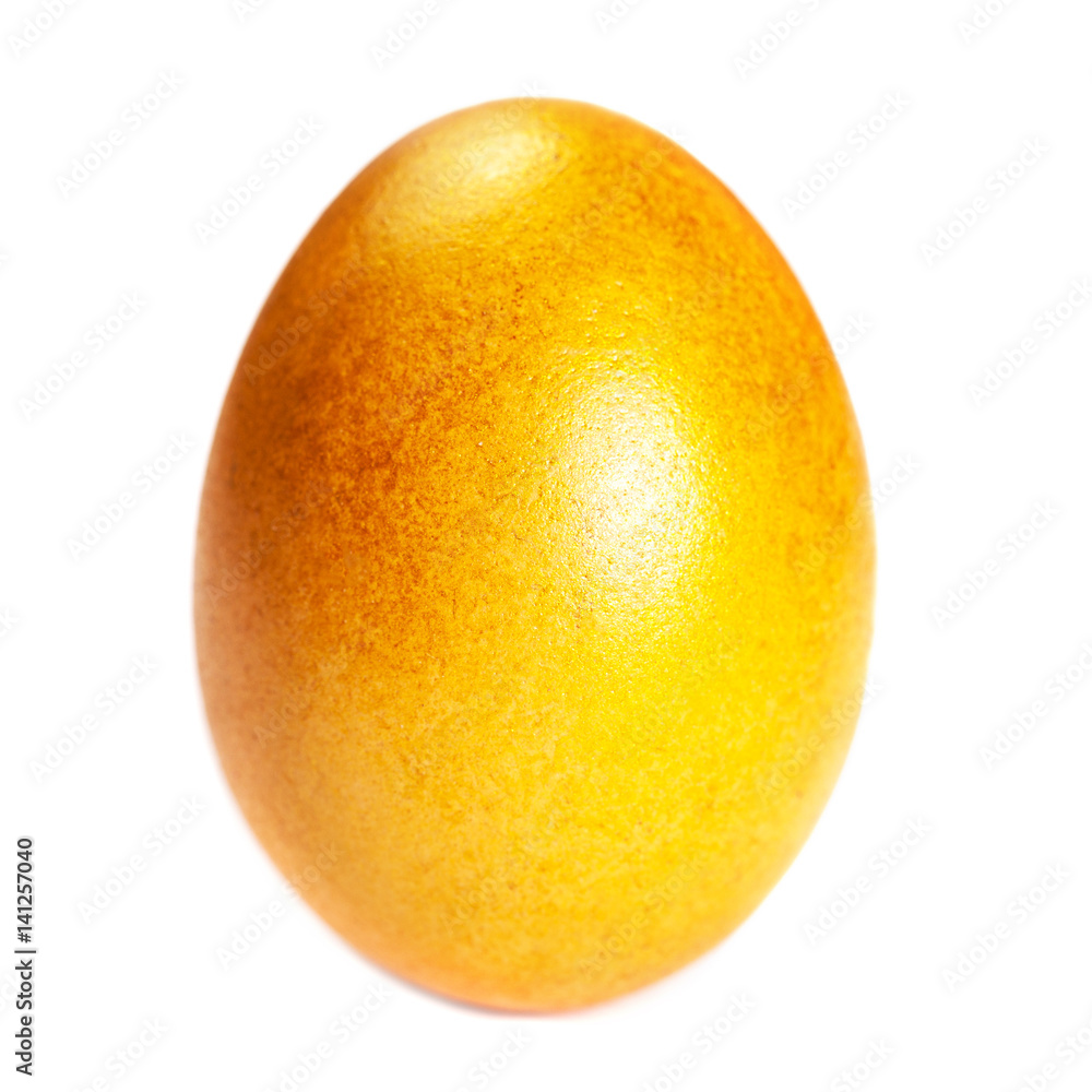 Golden colored Easter Egg isolated on white background close up. Happy Easter Handmade painted color Egg macro Golden colored Easter Egg isolated on white background close up. Happy Easter Handmade painted color Egg macro