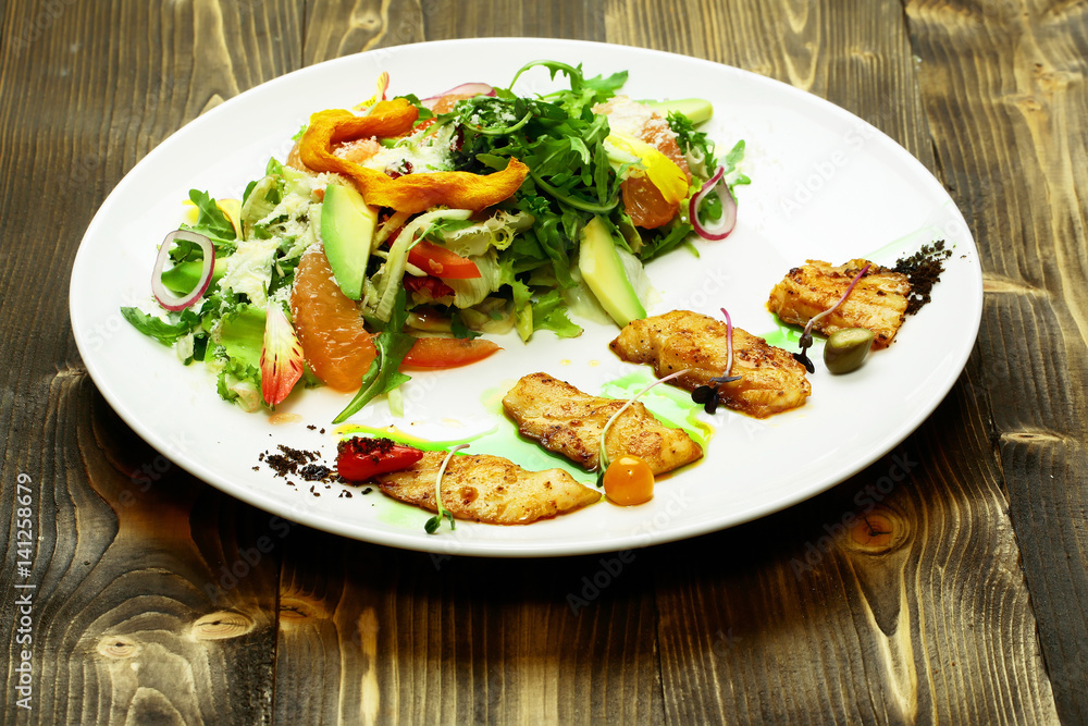 Fried fish and salad mix Fried fish and salad mix