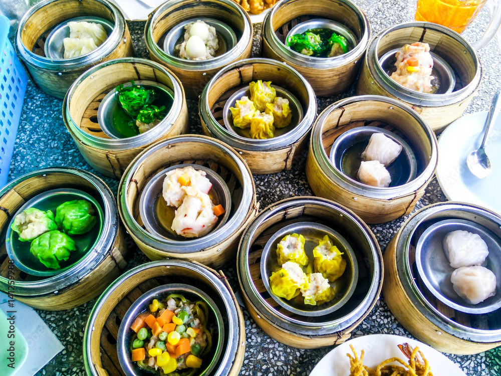 Chinese yumcha dimsum set in bamboo container Chinese yumcha dimsum set in bamboo container