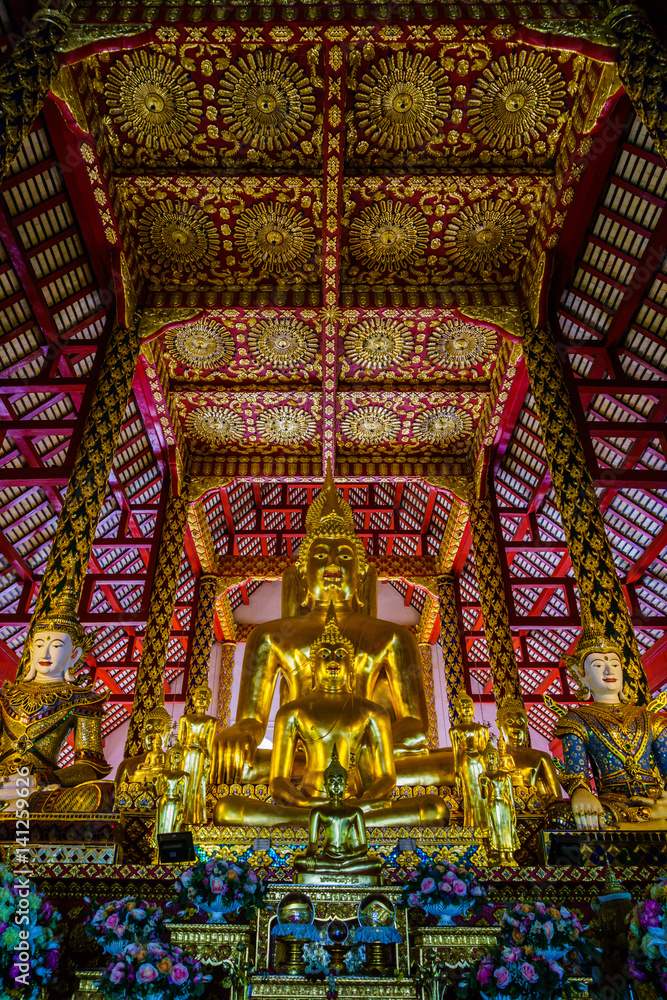 THAILAND,CHAINGMAI-Mar 12, 2017: suan dok temple. golden buddha statue with china architecture style.