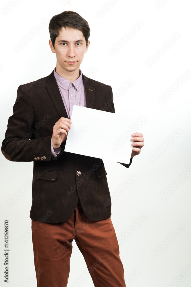 Happy businessman presenting empty paper.