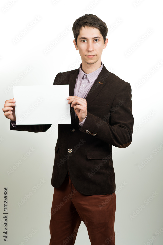 Happy businessman presenting empty paper. Happy businessman presenting empty paper.