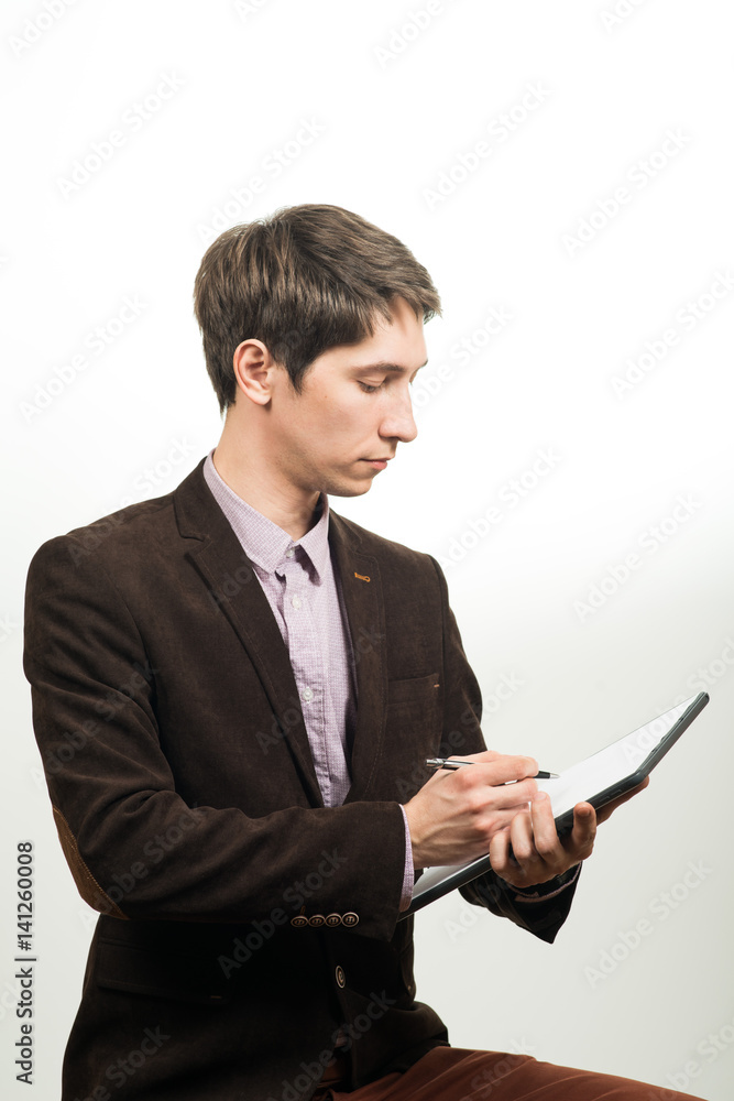 Smart businessman holding a sheet of paper and pen Smart businessman holding a sheet of paper and pen