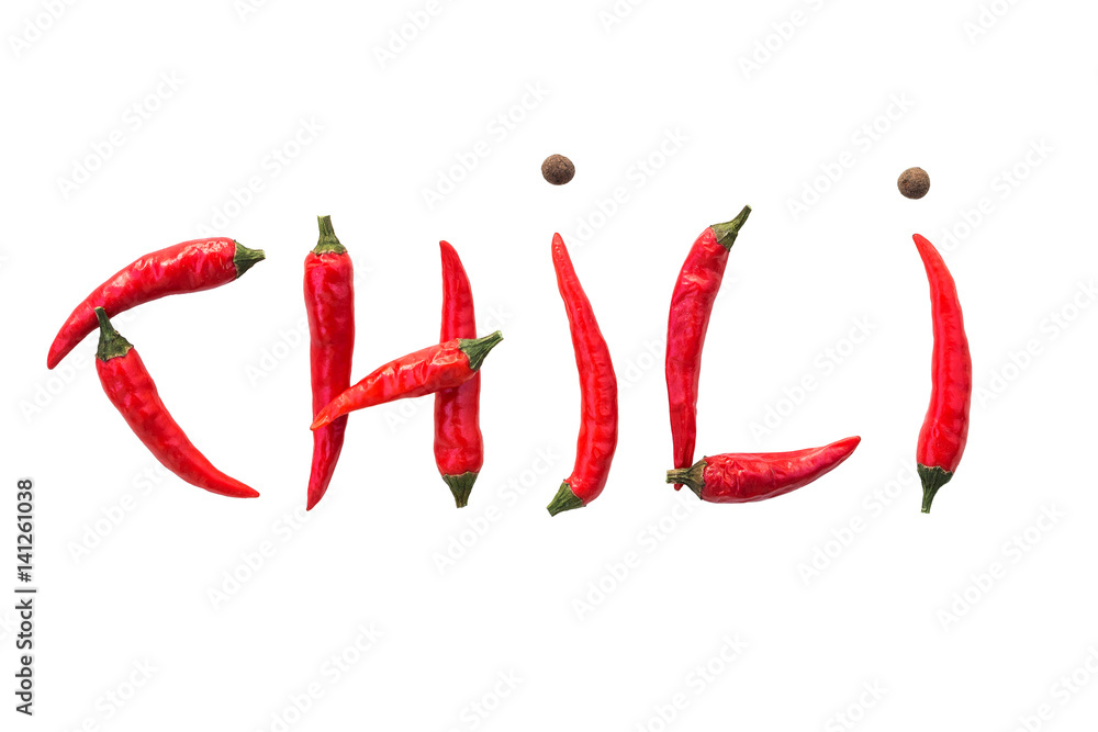 The word CHILI from fresh red chili peppers and dried black peppers on a white background, isolated. concept hot spice for food. top view, flat lay. The word CHILI from fresh red chili peppers and dried black peppers on a white background, isolated. concept hot spice for food. top view, flat lay.