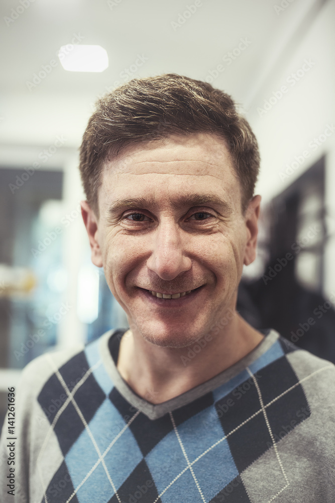 Portrait of a happy, confident man after a haircut - a new image Portrait of a happy, confident man after a haircut - a new image