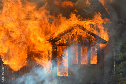 Close up of burning house.