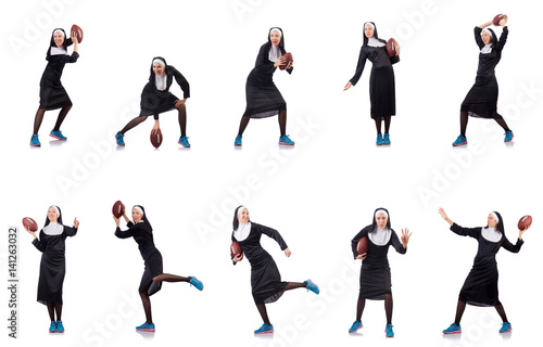 Pretty nun with rugby ball isolated on white
