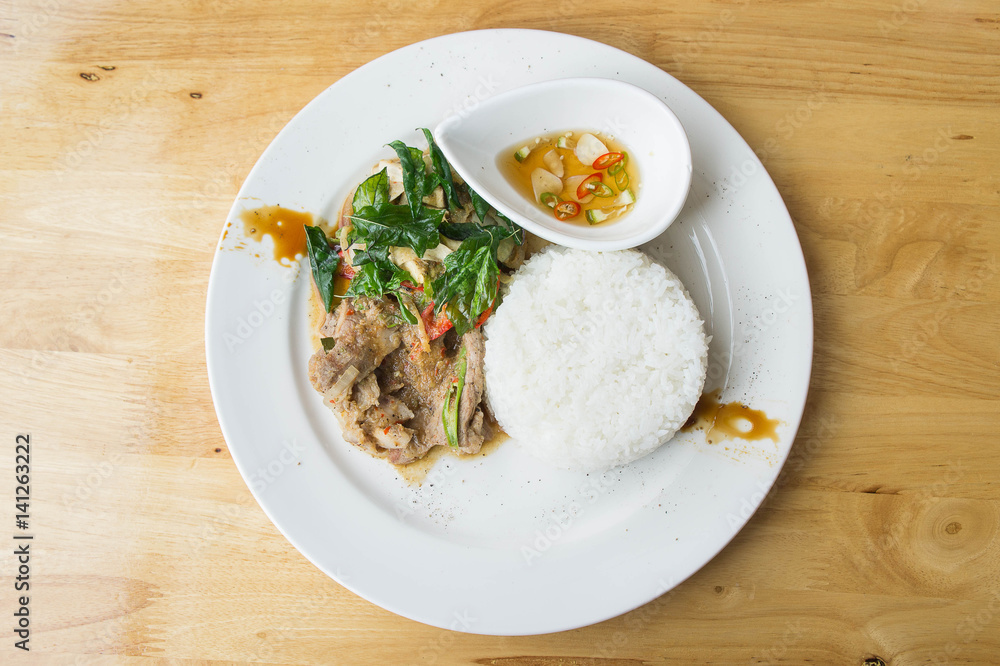 Grilled pork basil with Fried egg , stir basil with crispy pork , Kind of favarite Traditional Thai foods Grilled pork basil with Fried egg , stir basil with crispy pork , Kind of favarite Traditional Thai foods