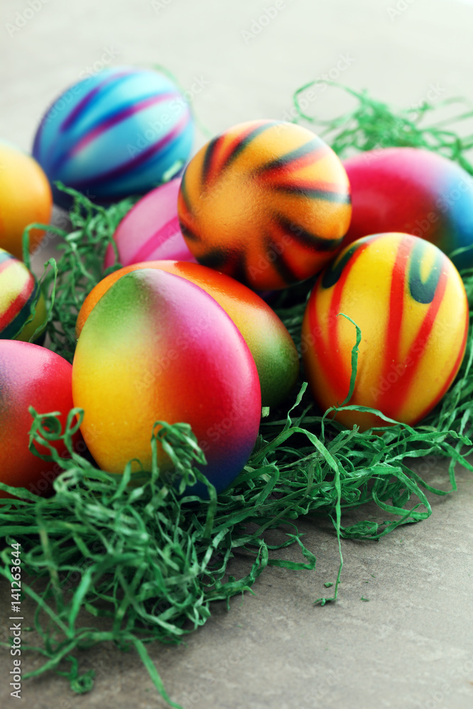 Row of Easter eggs on stone table Row of Easter eggs on stone table