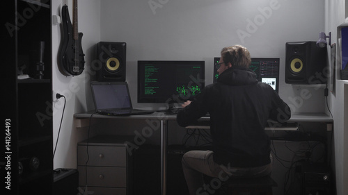 Close up of a criminal person trying to crack network. Spy is hacking computer database by disconnecting security firewall. Hacker is trying to gain unauthorized access to important information.