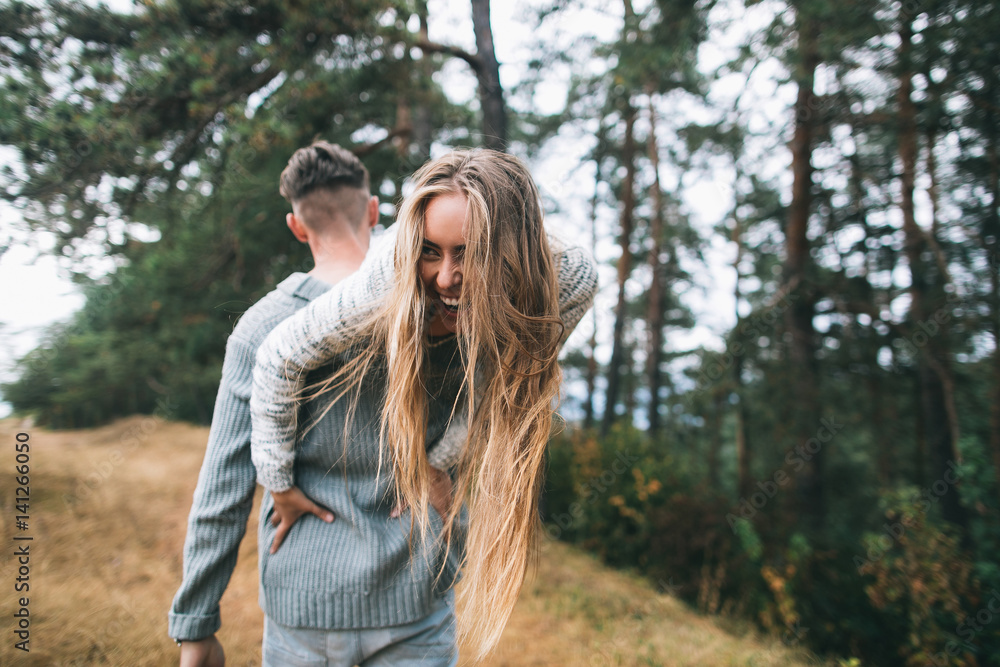 Beautiful youth couple flirting and joking in outdoor. Beautiful youth couple flirting and joking in outdoor.