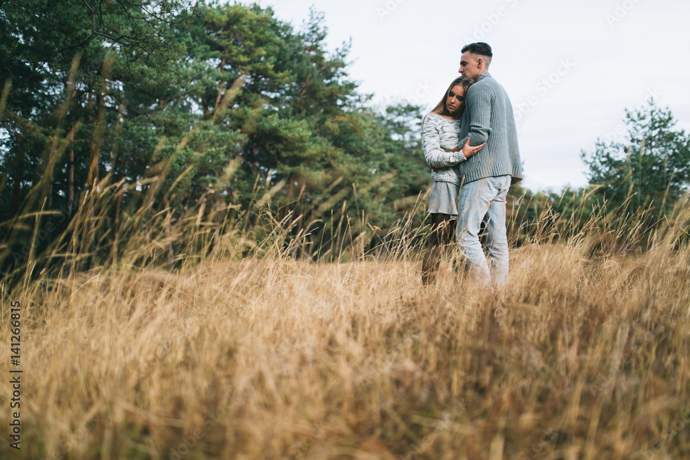 Beautiful youth couple flirting and joking in outdoor. Beautiful youth couple flirting and joking in outdoor.
