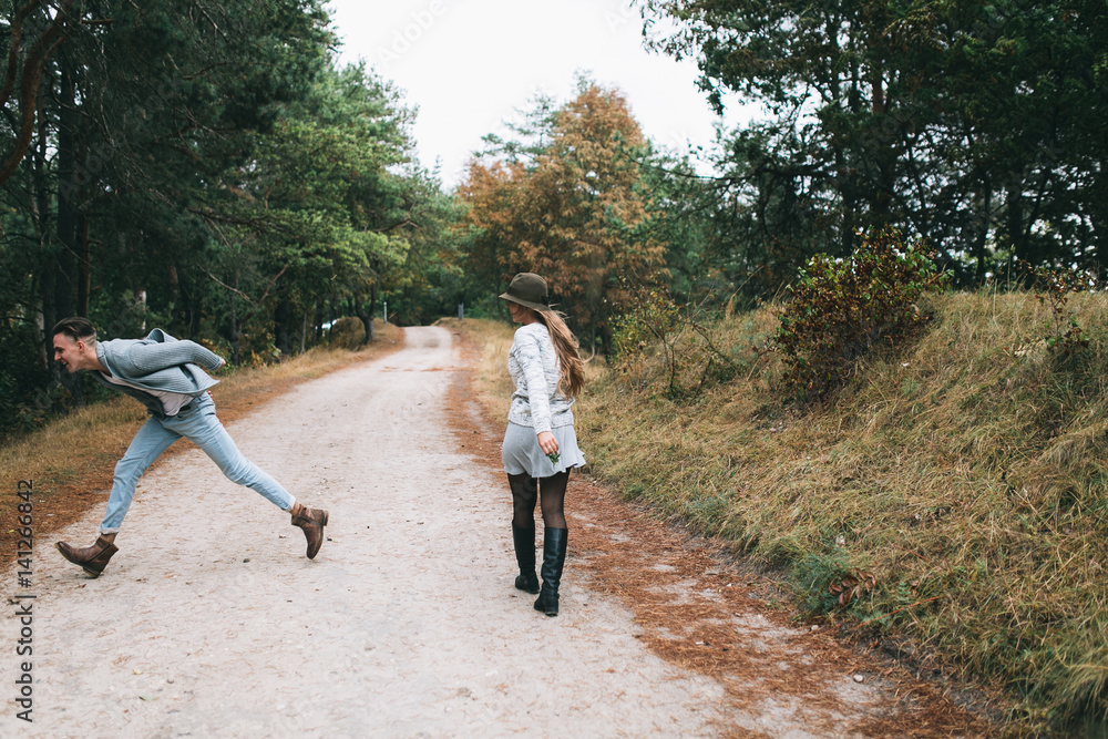 Beautiful youth couple flirting and joking in outdoor. Beautiful youth couple flirting and joking in outdoor.